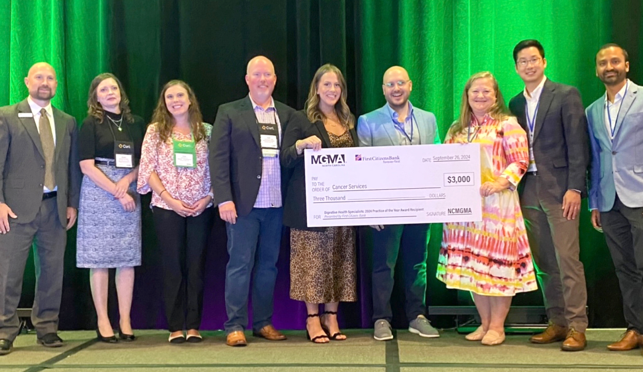Receiving award from NCMGMA for practice of the year 2024